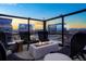 Rooftop patio featuring a fire pit and comfortable seating, perfect for relaxing at 1750 Wewatta St # 704, Denver, CO 80202