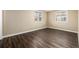 A bedroom featuring wood flooring and neutral paint tones at 1014 Ponderosa Cir, Longmont, CO 80504
