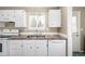 Clean kitchen featuring white cabinetry and modern appliances at 1014 Ponderosa Cir, Longmont, CO 80504