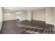Spacious living room featuring hardwood floors, neutral walls, and plenty of natural light at 1014 Ponderosa Cir, Longmont, CO 80504
