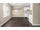 Hardwood floors connecting the living room to the kitchen at 1014 Ponderosa Cir, Longmont, CO 80504