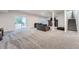 Finished basement with gray carpeting, a sofa, and access to the backyard at 55 N Pines Trl, Parker, CO 80138