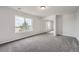 Spacious bedroom with a mirrored closet and a large window at 55 N Pines Trl, Parker, CO 80138