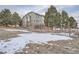 House exterior view showing landscaping and snow at 55 N Pines Trl, Parker, CO 80138