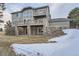 House exterior with stone accents and deck at 55 N Pines Trl, Parker, CO 80138