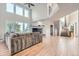 Spacious living room featuring hardwood floors, a fireplace, and large windows with scenic views at 55 N Pines Trl, Parker, CO 80138