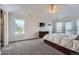 Spacious main bedroom with ample natural light, carpet flooring, and a private balcony at 55 N Pines Trl, Parker, CO 80138