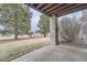 Stone patio with backyard access and landscaping at 55 N Pines Trl, Parker, CO 80138