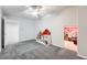 Playroom with ceiling fan, carpet, and access to another room at 55 N Pines Trl, Parker, CO 80138