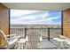 Scenic balcony with white chairs, offering an expansive view of the surrounding landscape and sky at 10151 E 138Th Pl, Brighton, CO 80602