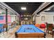 Finished basement boasting a pool table, bar, and entertainment area for social gatherings at 10151 E 138Th Pl, Brighton, CO 80602