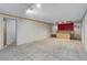Spacious finished basement with a wet bar, ample storage, and neutral carpeting at 3000 Alkire St, Golden, CO 80401
