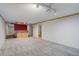 Partially finished basement with a wooden bar and neutral carpet, ready for entertaining at 3000 Alkire St, Golden, CO 80401