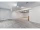 Unfinished basement area offering a neutral carpet and ample space for customization at 3000 Alkire St, Golden, CO 80401
