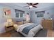 Staged bedroom showcasing neutral tones, coordinated decor, and hardwood flooring at 3000 Alkire St, Golden, CO 80401