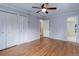 Bedroom with hardwood floors and an en suite bathroom, providing convenience and privacy at 3000 Alkire St, Golden, CO 80401