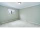 Bedroom with neutral carpet, a window for light, and a clean, simple design at 3000 Alkire St, Golden, CO 80401