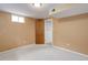 Bedroom with neutral carpet, a window, and a door leading to a closet at 3000 Alkire St, Golden, CO 80401