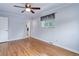 Bright bedroom with hardwood floors, a ceiling fan, and natural light from the window at 3000 Alkire St, Golden, CO 80401