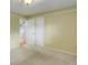Bedroom with carpet, closet space, and neutral walls with white trim at 3000 Alkire St, Golden, CO 80401