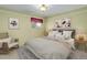 Bedroom showing neutral decor, coordinated accent pieces, and a comfortable rocking chair at 3000 Alkire St, Golden, CO 80401
