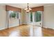 Hardwood floors and large windows define the bright dining room at 3000 Alkire St, Golden, CO 80401