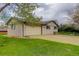 Spacious garage with extended driveway and fenced yard at 3000 Alkire St, Golden, CO 80401