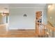 Hallway view featuring hardwood floors with a glimpse of the kitchen at 3000 Alkire St, Golden, CO 80401