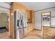 Well-equipped kitchen with stainless steel fridge and wooden cabinets at 3000 Alkire St, Golden, CO 80401