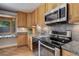 Modern kitchen with stainless steel appliances and granite countertops at 3000 Alkire St, Golden, CO 80401
