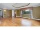 Spacious living room with hardwood floors and coffered ceiling at 3000 Alkire St, Golden, CO 80401