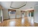 Open-plan living room featuring hardwood floors, coffered ceiling, and abundant natural light at 3000 Alkire St, Golden, CO 80401