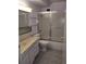 Bathroom featuring tiled floor, shower-tub combination and single sink vanity at 680 S Alton Way # 9A, Denver, CO 80247