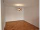 Bright dining room featuring beautiful parquet flooring, light walls, and vintage light fixture at 680 S Alton Way # 9A, Denver, CO 80247