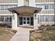 The main entrance of 680 S Alton Way with covered drop-off area at 680 S Alton Way # 9A, Denver, CO 80247