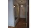 Hallway with a mirror, parquet floors, and a vintage light fixture at 680 S Alton Way # 9A, Denver, CO 80247