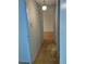 Hallway featuring parquet floors, a vintage light fixture, and an open view to the living room at 680 S Alton Way # 9A, Denver, CO 80247