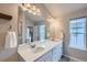 Double vanity bathroom with a large mirror and plenty of counter space at 9490 W 14Th Ave # 3, Lakewood, CO 80215