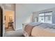 Bedroom with a desk, view of backyard, and built-in shelving at 9490 W 14Th Ave # 3, Lakewood, CO 80215