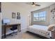 Bedroom with a bed, desk, and window with a view at 9490 W 14Th Ave # 3, Lakewood, CO 80215