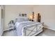 Spacious bedroom with a metal bed frame and plenty of closet space at 9490 W 14Th Ave # 3, Lakewood, CO 80215