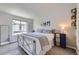 Bright bedroom with a metal bed frame, large window, and ample natural light at 9490 W 14Th Ave # 3, Lakewood, CO 80215