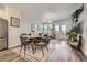 Open concept dining area with wood table and chairs at 9490 W 14Th Ave # 3, Lakewood, CO 80215