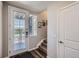 Bright entryway with stairs, door to patio, and coat closet at 9490 W 14Th Ave # 3, Lakewood, CO 80215