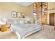 Vaulted ceiling bedroom featuring high windows and an accent chair at 6455 Dakota Ridge Dr, Golden, CO 80403