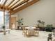 Bright breakfast nook with travertine flooring, a round table, and many plants at 6455 Dakota Ridge Dr, Golden, CO 80403