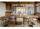 Inviting dining room featuring a wooden table with chairs, and open shelving at 6455 Dakota Ridge Dr, Golden, CO 80403