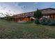 Expansive home exterior featuring an architectural design, large lawn, and inviting outdoor space at 6455 Dakota Ridge Dr, Golden, CO 80403
