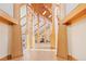Grand foyer with high ceilings, exposed wood beams, and an open floor plan leading to other living spaces at 6455 Dakota Ridge Dr, Golden, CO 80403