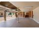 Spacious garage with multiple work stations, built in cabinets, and epoxy flooring at 6455 Dakota Ridge Dr, Golden, CO 80403